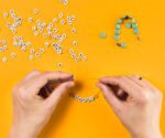 Hands making bracelets